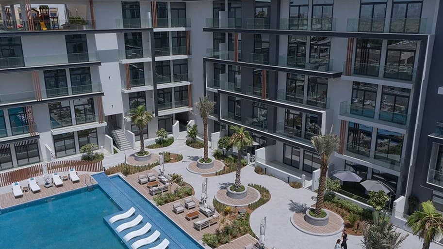Oxford 212 apartment buildings and landscaped swimming-pool courtyard in Jumeirah Village Circle